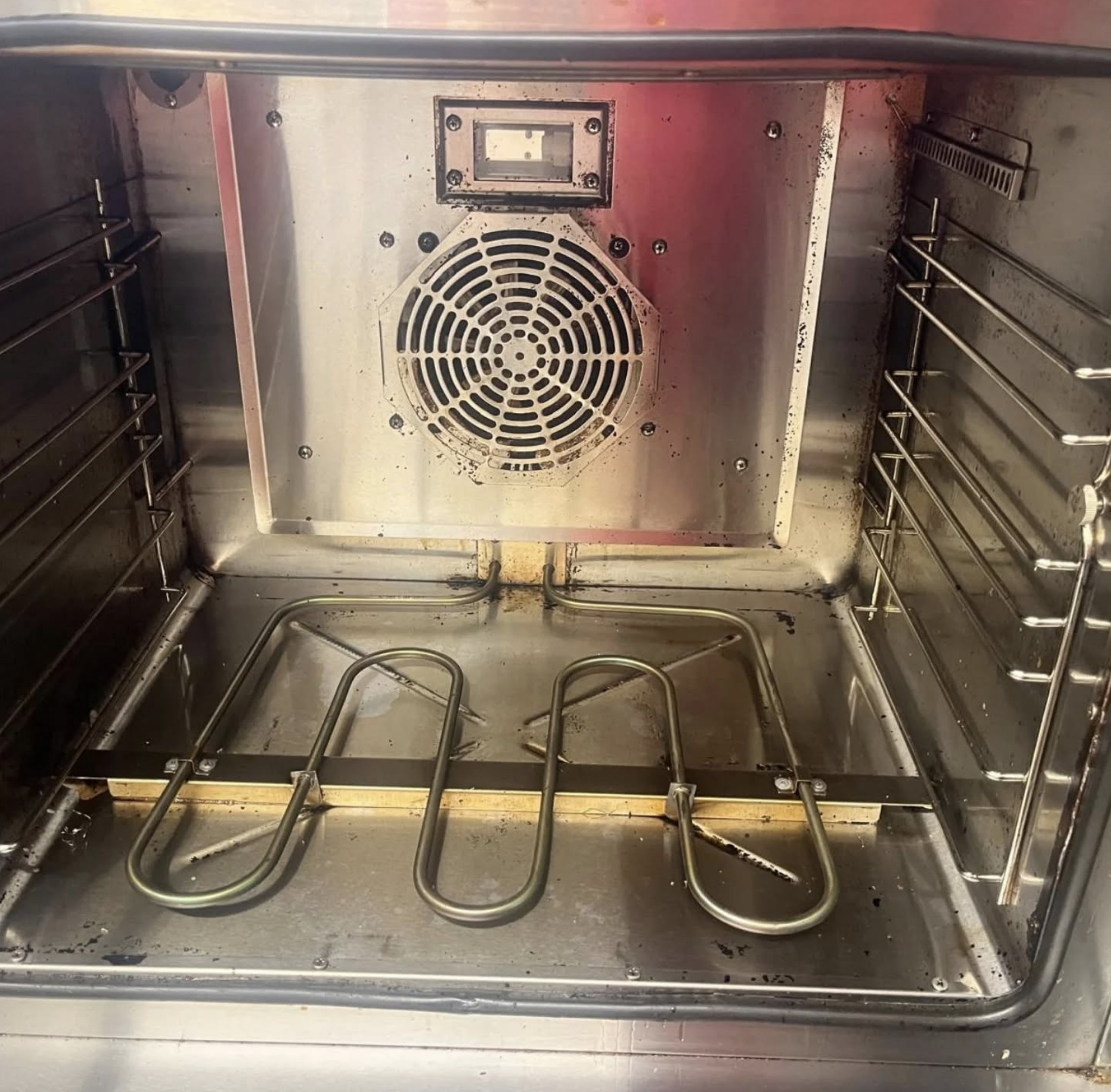 Commercial oven and extraction equipment during cleaning